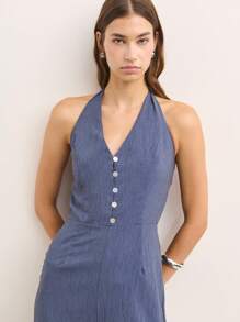 Nöista Open-Back Jumpsuit In Brown With Shoulder Straps And A Figure-Hugging Fit. This Modern And Versatile Design Is Perfect For Casual Events Or Night Outs During Spring, Summer, Or Fall. Easily Styled With Sandals, Heels, Or Sneakers For A Sexy And Elegant Look. - Blue - View 4