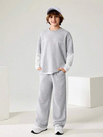 JNSQ Bộ trang phục 2 món cho bé trai tuổi teen, áo nỉ cổ tròn tay dài màu tương phản in chữ ngộ nghĩnh và quần nỉ dáng rộng, phù hợp mặc hàng ngày vào mùa thu, mùa đông, hoạt động ngoài trời, kỳ nghỉ, dạo phố, tiệc tùng và các dịp thường ngày