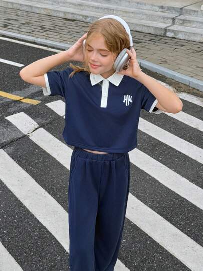 SHEIN 2pcs/Set Preteen Girls Polo Collar Short Sleeve Top And High Waist Wide Leg Pants Set, Sporty Casual Color Block Graphic Print, Button Down Closure, Spring/Summer, Suitable For Daily, Commute, Vacation