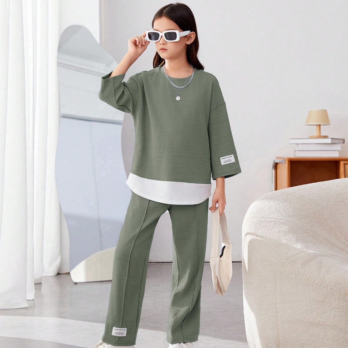 Conjunto de 2 piezas informal de niña preadolescente con top de punto holgado de cuello redondo y pantalones largos