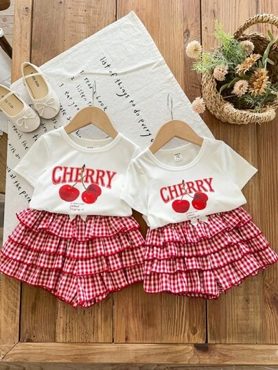 LMoss Kids LMoss   2pcs Toddler Girls' Casual Cherry Graphic Knit Top And Plaid Woven Shorts Set Cherry Baby Clothes Baby Girl Checkered Outfit Matching Baby Outfits Toddler Girl Summer Outfit Baby Matching Set Baby Girl Cherry Outfit Baby Matching Set Summer Girls Co Ord Set Girl Clothes Sets, Sisters Outfit, Girls School Uniform,School Tops,Tops For School Matching Baby Girl Outfits