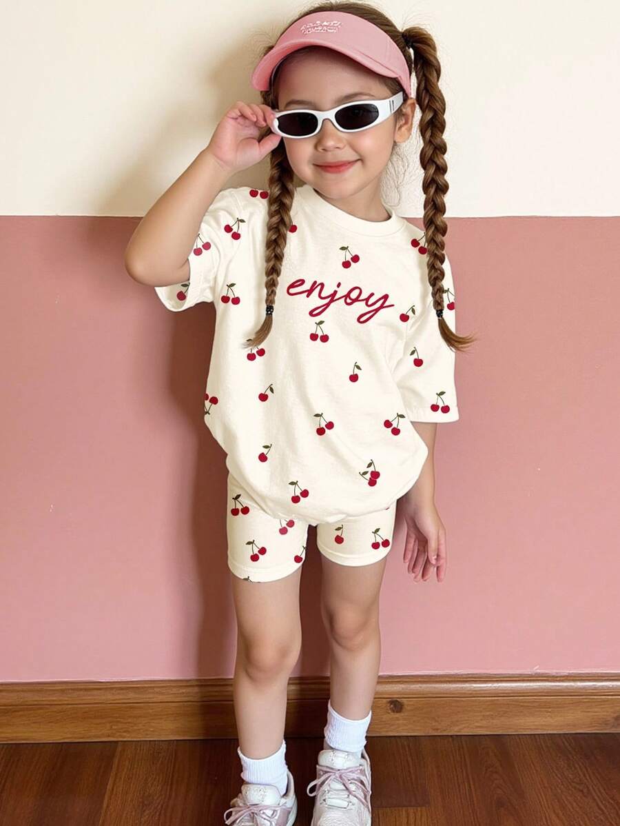 SHEIN Bộ đồ Happikins 2 món màu trắng kem dễ thương, họa tiết quả anh đào cổ điển và chữ đơn giản, áo thun tay ngắn cổ tròn dáng rộng và quần short ôm sát, phù hợp cho bé gái, thích hợp cho mùa hè, xuân, thu và đông, mặc ở nhà, đi chơi, dã ngoại, hoạt động ngoài trời, kỳ nghỉ. Bộ đồ trẻ em họa tiết quả anh đào hai mảnh cho bé gái, bộ đồ thoải mái hai mảnh dễ thương cho trẻ em. - Nhiều màu - Xem 1