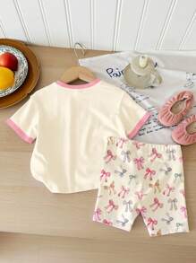 SHEIN Cream Color, Cute Bow Print "Daddy's Girl" Baby Girl Casual Round Neck Loose Short Sleeve T-Shirt And Shorts Set, Summer Outfits , Easy Comfort, Autumn Layers For Kids, Stylish Kids, Casual Wear, Kids Graphic Clothes, Back To School, Fall Clothes Baby Girl Summer Pajama Baby Girl Short Pants Sets Baby Girl Clothes Daddys Girl Outfit Infant Girl Summer Outfit