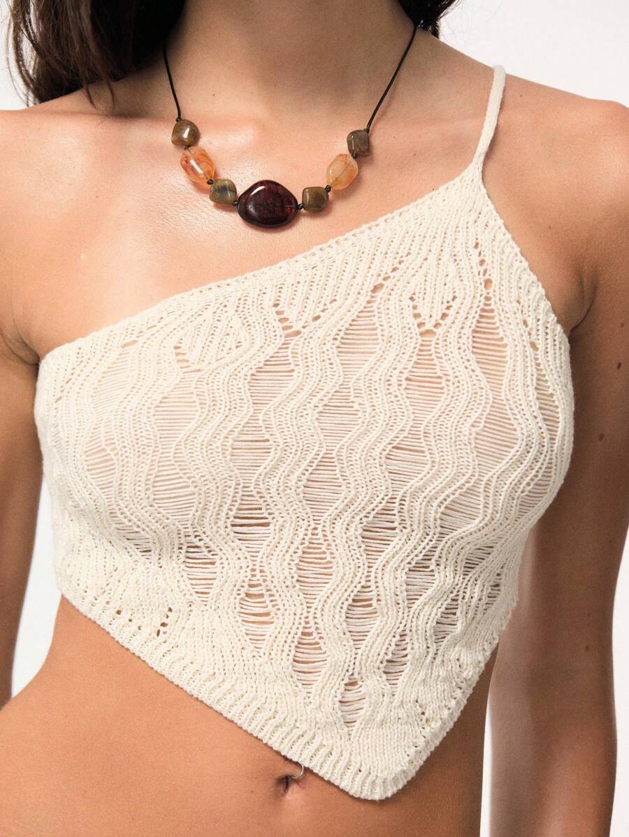 TypaGal This Cream One-Shoulder Top Features A Unique Wavy Knit Texture And Asymmetric Cut. A Chic Choice For Laid-Back Beach Outfits For Woman, Easily Paired With High-Rise Shorts For Vacation-Ready Style.