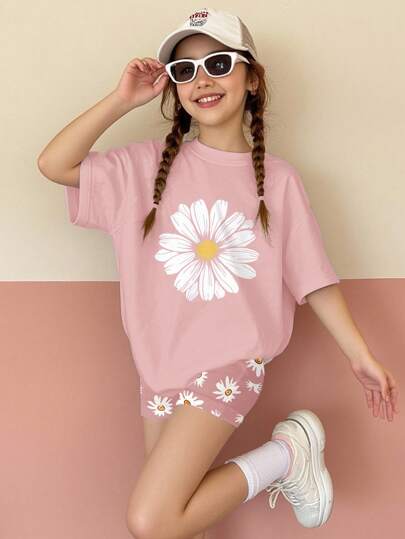 SHEIN Leap Crew 2件套少女休闲简约短袖宽松T恤和打底裤套装，适合夏季少女穿着。夏季短款套装，少女休闲印花杏色圆领短袖T恤，饰有雏菊图案，夏季童装雏菊印花两件套短款套装。