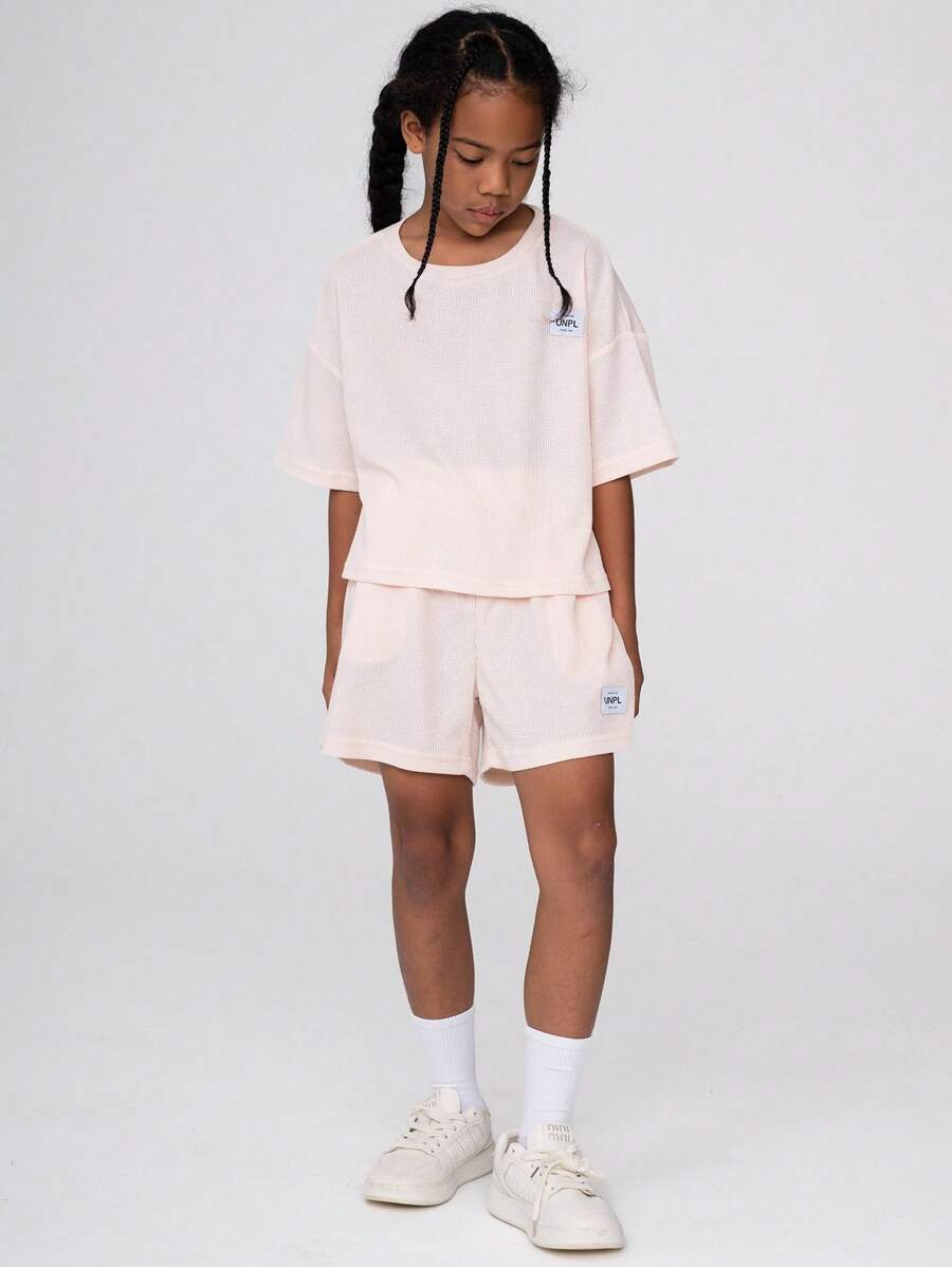 SHEIN Girls' T-Shirt Set,Pink Summer Casual Work Outfit For Tween Girls 8-12Y,Round Neck Short Sleeve Top&Loose Shorts,Unique Waffle Texture,Relaxed Fit - Apricot - View 1