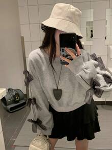 DAZY بلوزة كاجوال فضفاضة بياقة مستديرة وأكمام طويلة منسدلة مع زخرفة فيونكة، مناسبة للخريف والشتاء