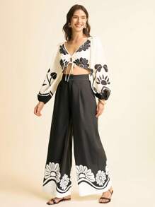 CAJUNI Damskie spodnie z szerokimi nogawkami i czarno-białym nadrukiem kwiatowym – odzież damska w stylu boho/odzież w stylu zachodnim dla kobiet/graficzna/codzienna – podstawowa/bluzki wyjściowe damskie/jesienna odzież damska - Wielokolorowe - Zobacz 1