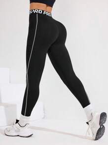 Easithlete Quần legging thể thao nữ màu đen với cạp quần phối màu, họa tiết sọc và in khẩu hiệu thể thao, chiều dài 3/4, phù hợp cho mặc hàng ngày, chạy bộ, Pilates, Yoga, tập gym, tennis. Quần legging thể thao nữ mùa thu có túi, quần legging tập luyện, quần legging tập gym, quần legging thể thao, quần legging đen, quần legging cho nữ. - màu đen - Xem 2