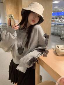 DAZY بلوزة كاجوال فضفاضة بياقة مستديرة وأكمام طويلة منسدلة مع زخرفة فيونكة، مناسبة للخريف والشتاء