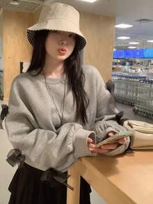 DAZY بلوزة كاجوال فضفاضة بياقة مستديرة وأكمام طويلة منسدلة مع زخرفة فيونكة، مناسبة للخريف والشتاء