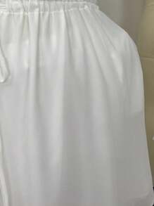 Solflare Vestido casual de gasa blanco sin mangas para tallas grandes