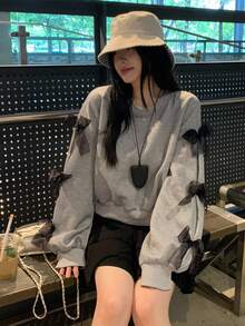 DAZY بلوزة كاجوال فضفاضة بياقة مستديرة وأكمام طويلة منسدلة مع زخرفة فيونكة، مناسبة للخريف والشتاء