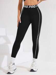 Easithlete Quần legging thể thao nữ màu đen với cạp quần phối màu, họa tiết sọc và in khẩu hiệu thể thao, chiều dài 3/4, phù hợp cho mặc hàng ngày, chạy bộ, Pilates, Yoga, tập gym, tennis. Quần legging thể thao nữ mùa thu có túi, quần legging tập luyện, quần legging tập gym, quần legging thể thao, quần legging đen, quần legging cho nữ. - màu đen - Xem 3