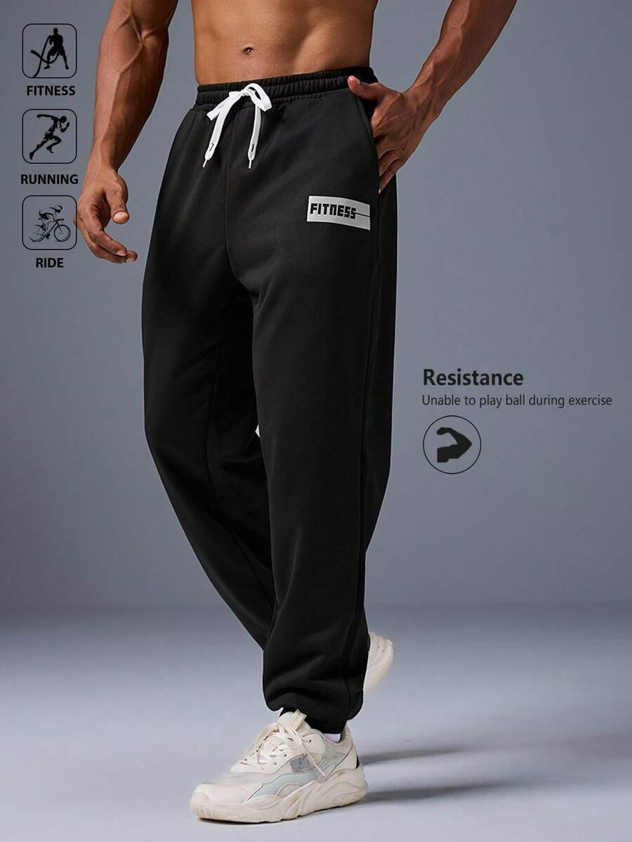 Manfinity Sport Corelite 男士字母印花弹力腰带抽绳口袋运动慢跑裤，吸汗轻盈舒适，修身剪裁，适合跑步、健身、休闲运动穿着。 - 黑色 - 查看 1