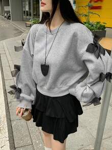 DAZY بلوزة كاجوال فضفاضة بياقة مستديرة وأكمام طويلة منسدلة مع زخرفة فيونكة، مناسبة للخريف والشتاء