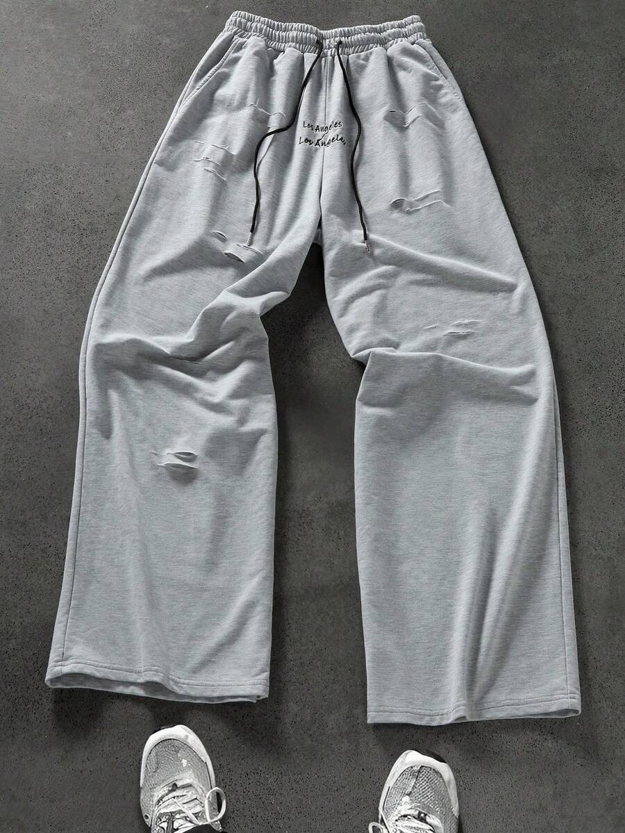 Manfinity EMRG Men's Loose Street Style Letter Embroidery Distressed Sweatpants Grey Baggy Sweatpants Ripped Sweatpants Sweatpants Patched Los Angeles Sweatpants Sweatpants With Holes Grey Sweatpants Los Angeles - Grey - View 1
