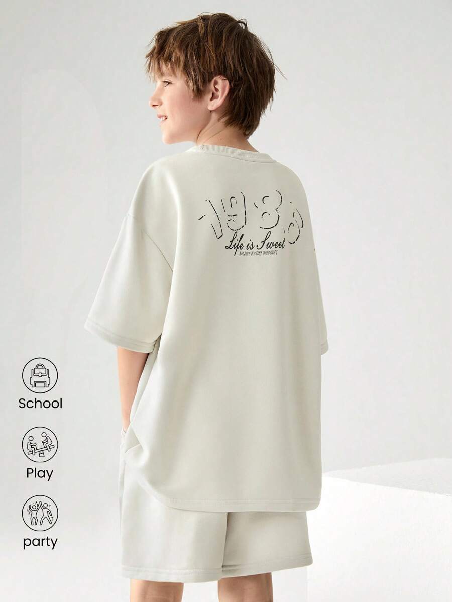 JNSQ Ensemble sweat-shirt à capuche et shorts de sport décontracté pour la rentrée scolaire, t-shirt oversize à col rond avec imprimé graphique de lettres amusantes et shorts pour enfants - Kaki - Voir 1