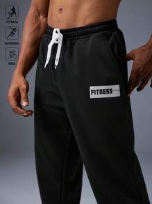 Manfinity Sport Corelite 男士字母印花弹力腰带抽绳口袋运动慢跑裤，吸汗轻盈舒适，修身剪裁，适合跑步、健身、休闲运动穿着。 - 黑色 - 查看 7