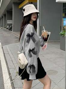 DAZY بلوزة كاجوال فضفاضة بياقة مستديرة وأكمام طويلة منسدلة مع زخرفة فيونكة، مناسبة للخريف والشتاء