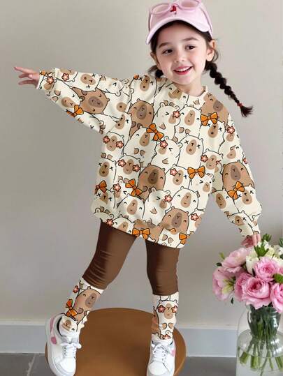 SHEIN 2 件套年轻女孩休闲水豚豹纹和樱桃蝴蝶结装饰圆领长袖运动衫和紧身裤，适合秋冬季、返校季、2000 年代/Y2K 风格