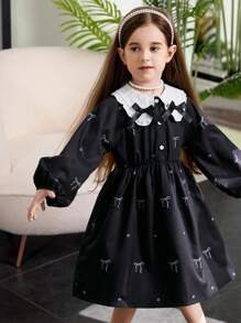 年轻女孩拼色蝴蝶结装饰连衣裙