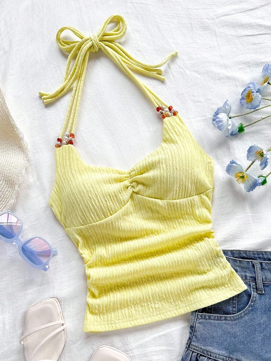 Soleia Top ajustado de tirantes en V con espalda descubierta y decoración de perlas, color amarillo, adecuado para playa, vacaciones, festivales de música, estilo bohemio - Amarillo - Ver 1