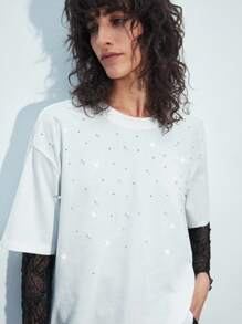 Maija Blusa suelta de manga corta con cuello redondo, de ajuste holgado, de color blanco, con diseño gráfico con perlas y cristales brillantes, versátil y alegre, adecuada para fiestas y festivales de San Valentín