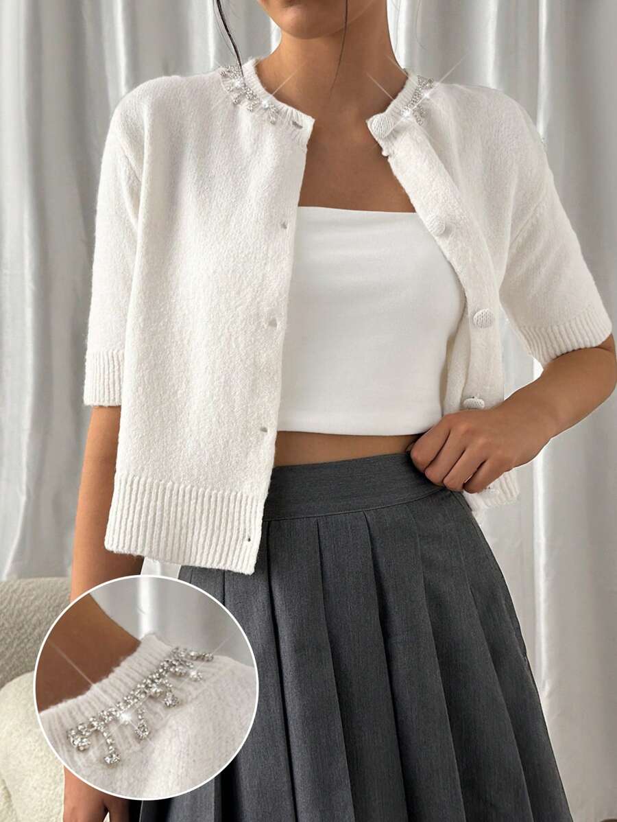 EURMUSE Women's Embellished Button-Up Wool Cardigan – Short-Sleeve Design With Delicate Beaded Neckline Detailing, Ribbed Hem Edges, And Soft Knit Fabric For A Cozy Yet Chic Winter Layer White Cropped Cardigan White Knit Cardigan Rhinestone Cardigan Pearl Button Cardigan,Long Cardigans Woman,Petite Cardigans,Cardigans - Cream - View 1