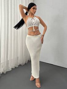 SHEIN Conjunto de 2 piezas de punto a ganchillo hecho a mano estilo boho para vacaciones, que incluye top con cuello de halter calado y flecos y una falda larga calada con cordón en unicolor