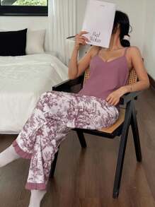 SHEIN Set de ropa de dormir para mujer de 2 piezas - Top de camiseta de unicolor y pantalones largos estampados