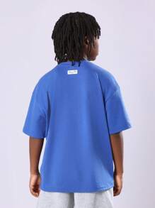 SUMWON T-shirt décontracté surdimensionné Samicon Studios Beverly Hills avec logo imprimé. Vêtement essentiel de mode pour jeunes garçons, style streetwear, confort quotidien pour ados