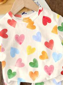 SHEIN Bộ 2 món/Bộ áo thun tay ngắn và quần short in hình trái tim nhiều màu sắc màu trắng kem dễ thương cho bé gái, kỳ nghỉ hè, cảm giác nghỉ dưỡng, họa tiết hoa cổ điển, màu pastel hoàng hôn, thư giãn - Nhiều màu - Xem 5