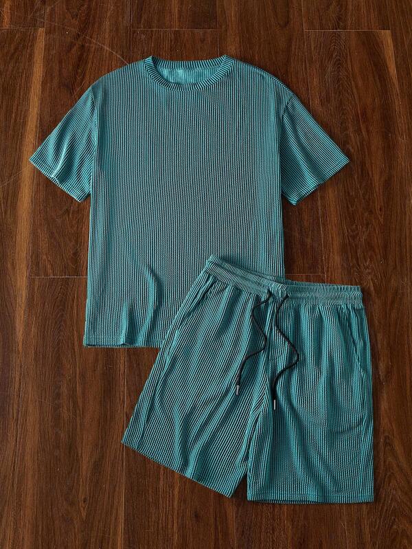 Manfinity Unisex Set de 2 piezas de camiseta de manga corta holgada casual de punto y pantalones cortos rectos de cintura elástica para hombre, cosas de pareja