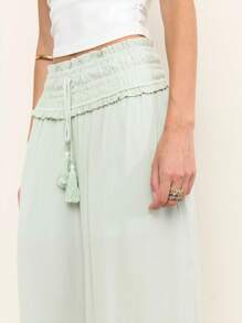 Nöista 浅绿色夏季阔腿裤，高腰褶饰，荷叶边。轻盈飘逸，适合温暖天气，是夏季装扮、旅行日或轻松惬意的7月4日造型的完美之选。