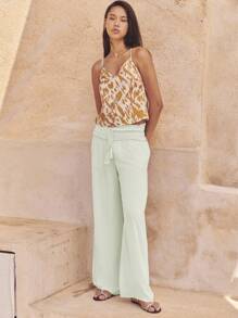 Nöista 浅绿色夏季阔腿裤，高腰褶饰，荷叶边。轻盈飘逸，适合温暖天气，是夏季装扮、旅行日或轻松惬意的7月4日造型的完美之选。