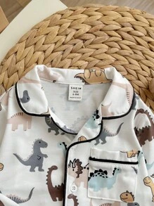 2 piezas/Set Pijama casual suelto de punto cómodo para bebé niño, con camisa de manga larga con bolsillo, cuello con solapa y pantalón recto con estampado de dinosaurio de dibujos animados