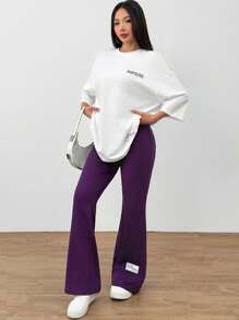 Mulvari 2pcs/Set Women Letter Print Round Neck Tee And Flared Pants, Casual Women's Summer Slogan Print Dropped Shoulder T-Shirt And Casual Pants 2pcs/Set, Casual Outfits Tracksuit 2 Pieces Lounge Set, Suitable For Walking/Sports/Back To School & Everyday Casual Wear Contains Cotton, Quick Sweat Absorption