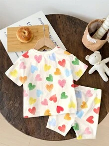 SHEIN Bộ 2 món/Bộ áo thun tay ngắn và quần short in hình trái tim nhiều màu sắc màu trắng kem dễ thương cho bé gái, kỳ nghỉ hè, cảm giác nghỉ dưỡng, họa tiết hoa cổ điển, màu pastel hoàng hôn, thư giãn - Nhiều màu - Xem 3