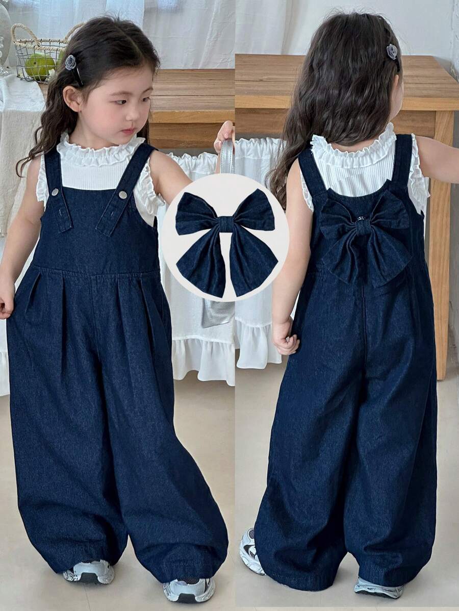 SHEIN Young Girl Deep Blue Denim Suspenders With A Three-Dimensional Bow On The Back,Kid Girls Spring And Summer Casual Vacation Country Boho Wear, Beach Outfits For Kid Girls,Western Street Wear For Girl,Spring Break Outfits,Rave Outfits Festival Denim Overalls,Young Girl Vacay Outfits
