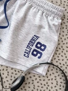 Pantalones cortos de niña adolescente con estampado floral gris y números bordados en color contrastante, adecuados para todas las estaciones, ropa urbana, deportes, uso casual