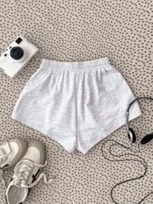 Pantalones cortos de niña adolescente con estampado floral gris y números bordados en color contrastante, adecuados para todas las estaciones, ropa urbana, deportes, uso casual