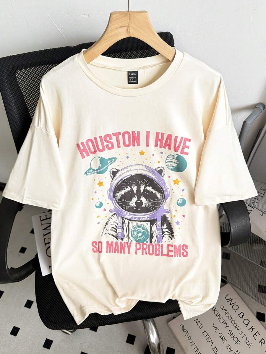 INAWLY Camiseta con diseño de mapache - Camiseta vintage divertida con mapache - Camiseta de mapache astronauta - Camisa con estampado retro - Camiseta con estampado de mapache para mujer, camisetas gráficas para mujer - Albaricoque - Ver 1