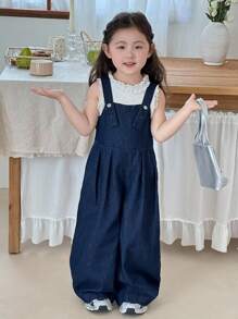 SHEIN Young Girl Deep Blue Denim Suspenders With A Three-Dimensional Bow On The Back,Kid Girls Spring And Summer Casual Vacation Country Boho Wear, Beach Outfits For Kid Girls,Western Street Wear For Girl,Spring Break Outfits,Rave Outfits Festival Denim Overalls,Young Girl Vacay Outfits