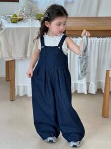 SHEIN Young Girl Deep Blue Denim Suspenders With A Three-Dimensional Bow On The Back,Kid Girls Spring And Summer Casual Vacation Country Boho Wear, Beach Outfits For Kid Girls,Western Street Wear For Girl,Spring Break Outfits,Rave Outfits Festival Denim Overalls,Young Girl Vacay Outfits