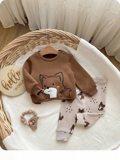 SHEIN Conjunto de sudadera de manga larga y pantalones con estampado de dibujos animados lindos para bebé recién nacido niña