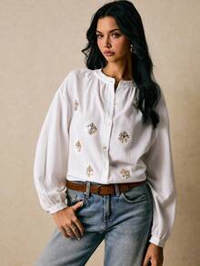 Poéselle Blouse en coton brodée d'œil du mal de style boho - Chemise à manches ballons à boutons blancs, Top boho brodé, Blouse blanche pour femmes, Chemise à manches ballons, Broderie motif œil, Blouse cottagecore, Festival femmes, Chemise mode à manches longues à paillettes motif œil pour femmes, Costumes d'Halloween, Automne femmes - Blanc - Voir 3