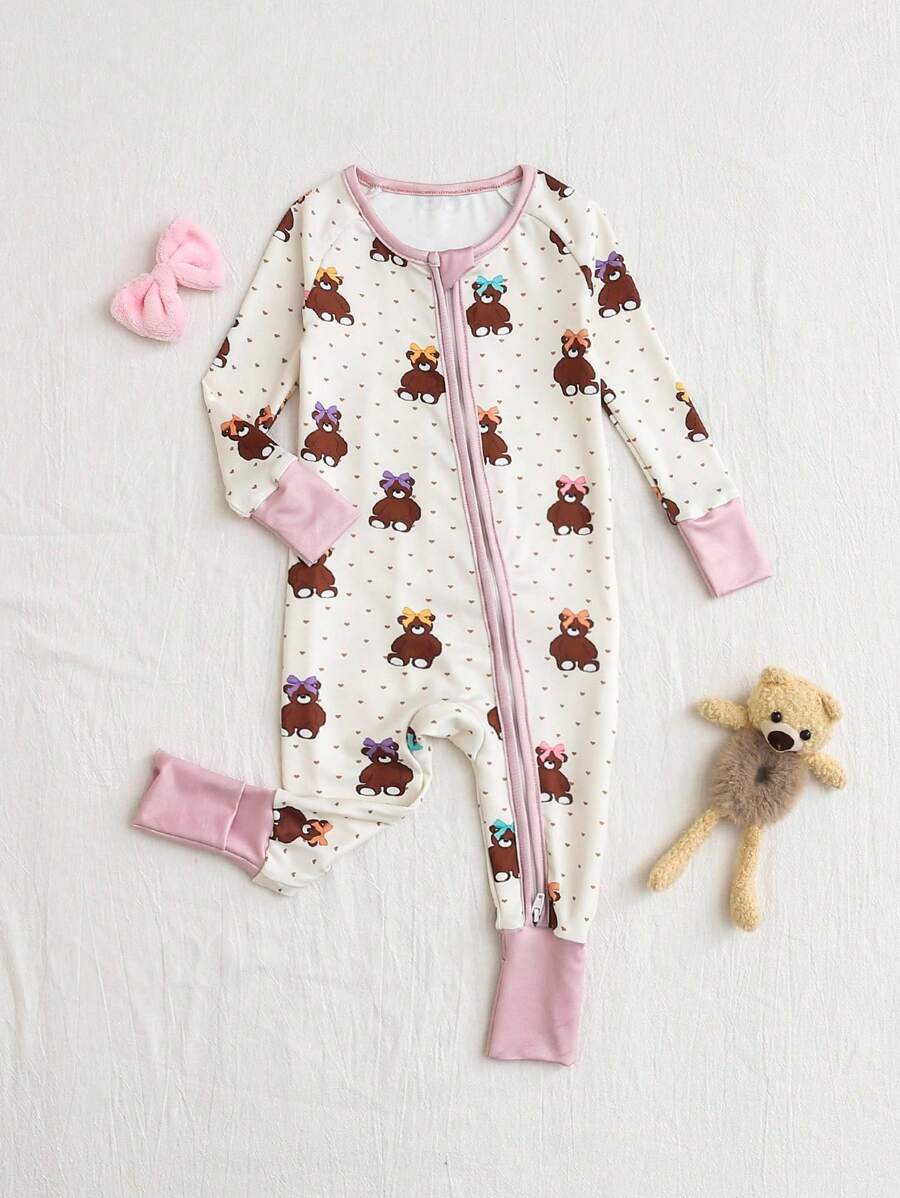 Dziewczęcy kombinezon piżamowy z długim rękawem i nadrukiem w kokardę z kreskówki i misiem, dopasowany do ciała, zapinany na zamek