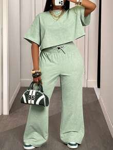Slaydiva Bộ đồ hai mảnh thoải mái mùa hè và thu 2025 Áo thun ngắn tay cổ tròn màu xanh lá cây rộng rãi + Quần ống rộng buộc eo cho nữ, thích hợp cho du lịch hàng ngày, trở lại trường, tốt nghiệp Bộ đồ hai mảnh cho nữ Bộ đồ mặc nhà 2 mảnh thoải mái cho nữ Bộ đồ hai mảnh thường ngày cho nữ - màu xanh lá - Xem 7