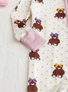 Dziewczęcy kombinezon piżamowy z długim rękawem i nadrukiem w kokardę z kreskówki i misiem, dopasowany do ciała, zapinany na zamek